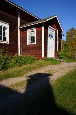 Ikaalinen, Finland. September 7, 2024 - Kovero Heritage Farm, wooden building in Seitseminen National Park during a sunny afternoon clipart