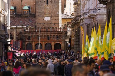 bologna, Italy. October 6, 2024 - Large crowd on Via Rizzoli street during Campagna Amica farmers market clipart