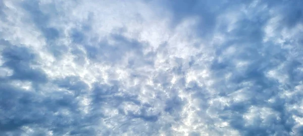 Stock image blue sky that can be used as a background, with beautiful clouds and perfect sun