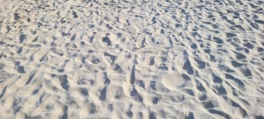 image of white sand beach on the coast on a sunny day