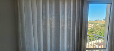 Radiant and welcoming, this sunlit house curtain creates a warm and inviting atmosphere. Purchase this image and illuminate your projects with luminosity and comfort clipart