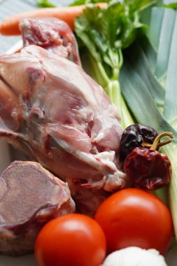 Ingredients for making Chicken broth with chicken bone, jamn bone and vegetables