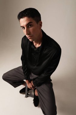 Handsome man with serious expression and ideas, looking at the camera. Mindset. High quality photo.