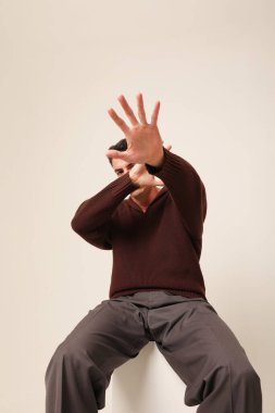 Young man with serious expression, with mental health issues. Vertical. High quality photo.