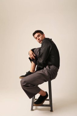 Handsome man with serious expression and ideas, looking at the camera. Mindset. High quality photo.