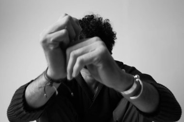 Young man posing in the studio. Mind set and mental health. High quality photo.