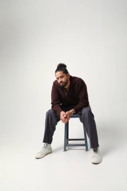 Portrait of young man posing in the studio. Mind set and mental health. High quality photo.
