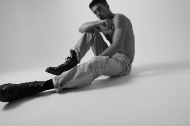 Handsome man with serious expression and ideas, looking at the camera. Mindset. High quality photo.