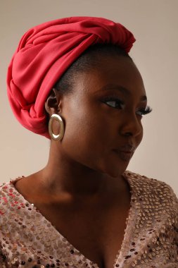 Muslim young woman wearing pink hijab looking aside posing indoor. Vertical. High quality photo.