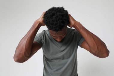 African American athletic man with doing neck stretching exercises. Mock-up. High quality photo.