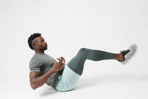 stock image Portrait of athletic young man doing muscle stretching exercises. Mock-up. High quality photo.