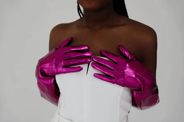 Crop portrait of african woman wearing gloves and elegant white dress. Mock-up. High quality photo.