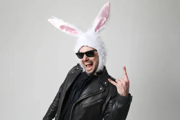 Emotional Bearded Man Wearing Bunny Ears Sunglasses Posing Indoor Vertical Stock Picture