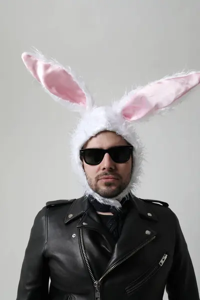 Young Bearded Man Wearing Bunny Ears Sunglasses Posing Indoor Vertical Stock Photo