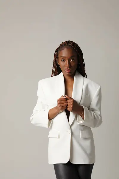 Beautiful Young African American Woman Wears White Blazer Posing Grey Стокове Зображення
