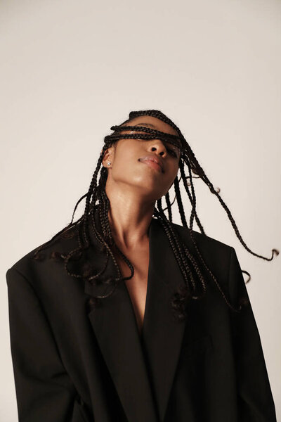 Vertical portrait of African American stylish woman looking at the camera. Mock-up. High quality photo.