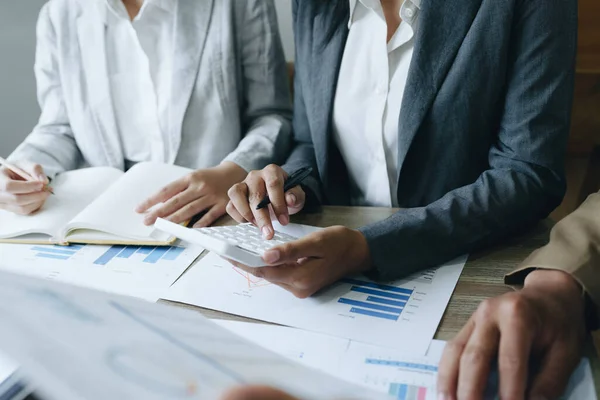 stock image Asian entrepreneurs and business people meeting in a conference room in business planning, financial budget and investment risk assessment to analyze customer groups to increase company growth.