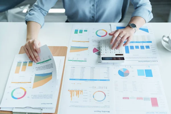 Stock image financial, Planning, Marketing and Accounting, portrait of Asian employee checking financial statements using documents and calculators at work..