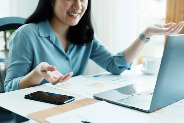 stock image Portrait of a beautiful Asian teenage girl using computer for video conferencing at office.