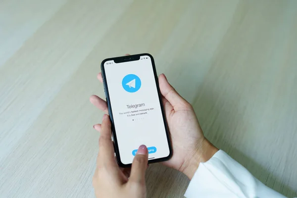 Stock image CHIANG MAI, THAILAND - Sep 08, 2022 - Telegram application icon on Apple iPhone Xs screen close-up. Telegram app icon. Telegram is an online social media network. Social media app.
