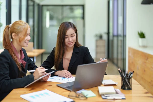 stock image Portrait of an Asian businesswoman consulting, start up a marketing plan to meet the needs of customers in office room