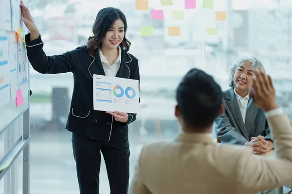 stock image Asian entrepreneurs and business people meeting in a conference room in business planning, financial budget and investment risk assessment to analyze customer groups to increase company growth.