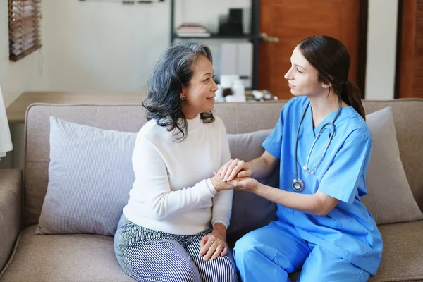 stock image Portrait of a female doctor holding a patients hand to encourage the fight against disease