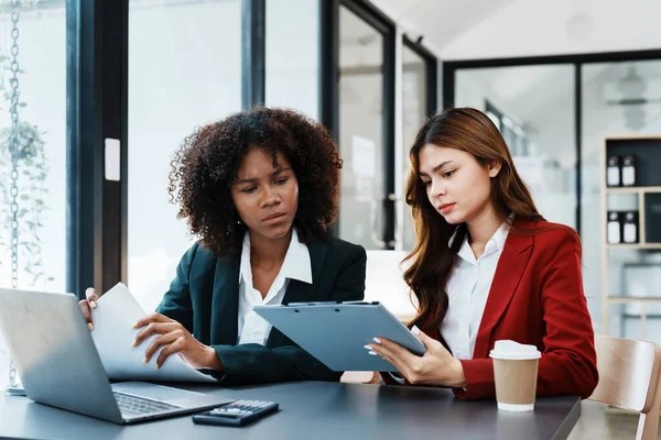 stock image Multiethnic business, Beautiful American African with asian businesswomans people in meeting. Accountant people do document, tax, exchange, accounting and Financial advisor.