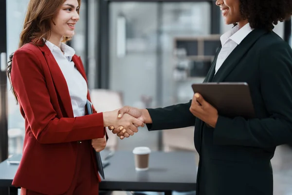 stock image Multi ethnic business Financial shaking hands, Successful businessmen handshaking after good deal. Business Finishing up meeting contract concept.