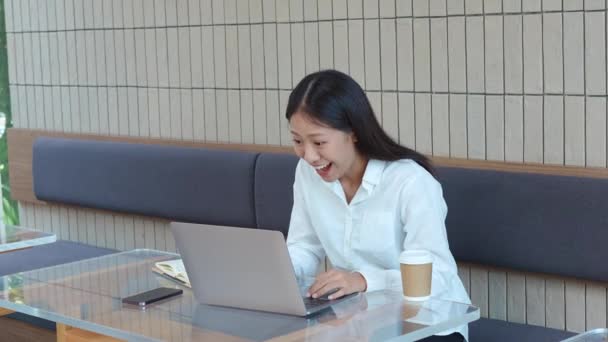 Young Asian Woman Using Computer Happy Expression Success Cafe Shop — Stock Video