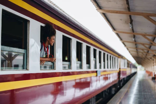 stock image Tourists african american are showing happy expressions while waiting for their journey in the train station