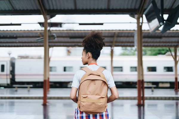 stock image Tourists african american are showing happy expressions while waiting for their journey in the train station