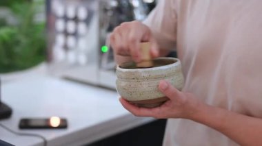  Coffee shop staff doing matcha bhucha for customers. High quality 4k footage