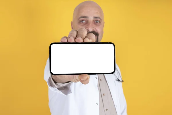 Male Doctor Showing Big Horizontal Smartphone White Blank Screen Mock — Stock fotografie