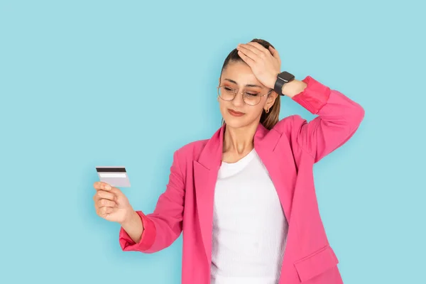 Stressed woman, portrait of sad confused stressed woman. Holding looking bank credit card. Hand on head. Something going wrong, mistake, rejected online payment, problem paying internet. Bad gesture.
