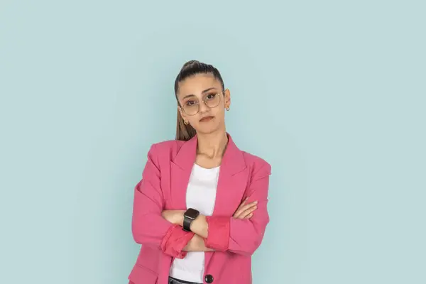 Sad young business woman, portrait of frowning offended dissatisfied sad young business woman. Wear formal pink jacket, hold hands arms crossed folded. Looking camera. People lifestyle concept idea.