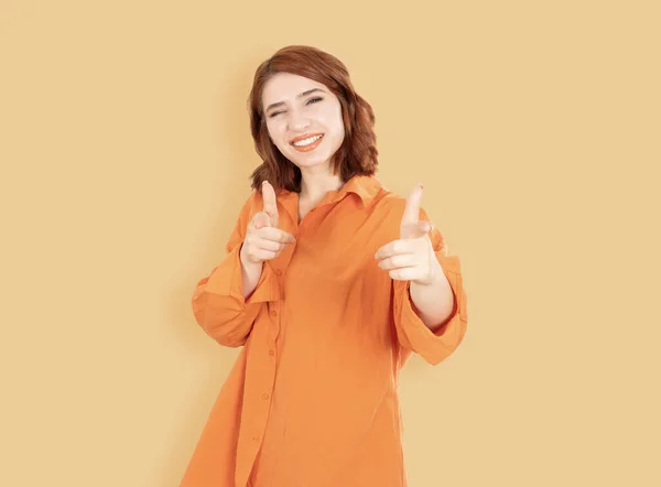 Woman pointing camera and smiling, portrait of young caucasian red bob hair woman pointing camera and smiling. You got this, congrats, congratulating, I choose you, blink an eye. Lifestyle concept.