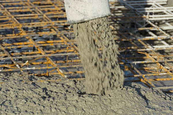 Concrete pump pumps liquid concrete into steel reinforcement