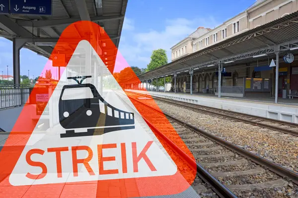 stock image Empty train station with German warning sign: Streik (strike)