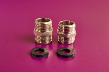 Boru hattı elementleri ve lastik contalar için harici iplikli çift meme ucu. Tesisat ve ısıtma..