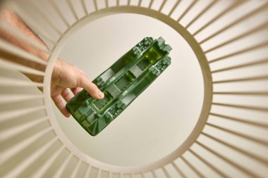 The plastic element of the packaging is disposed of and recycled in the waste bin. View from below. The concept of disposal and recycling of waste.