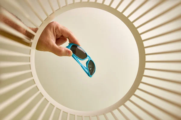 stock image Sunglasses are disposed of and recycled in the trash. View from below. The concept of disposal and recycling of waste.