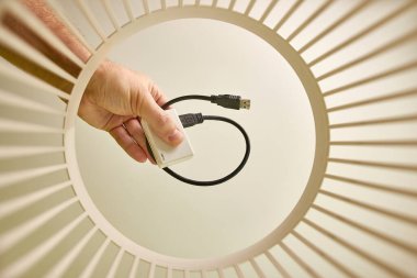 The old card reader is thrown away and recycled in the trash. View from below. The concept of recycling and disposal.