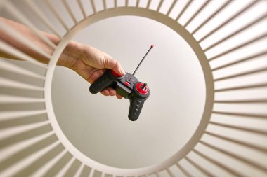 An old toy car remote control is discarded and recycled in the trash. View from below. The concept of recycling and disposal.