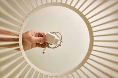 Chargers for smartphone batteries are disposed of and recycled in the trash. View from below. The concept of disposal and recycling of waste.