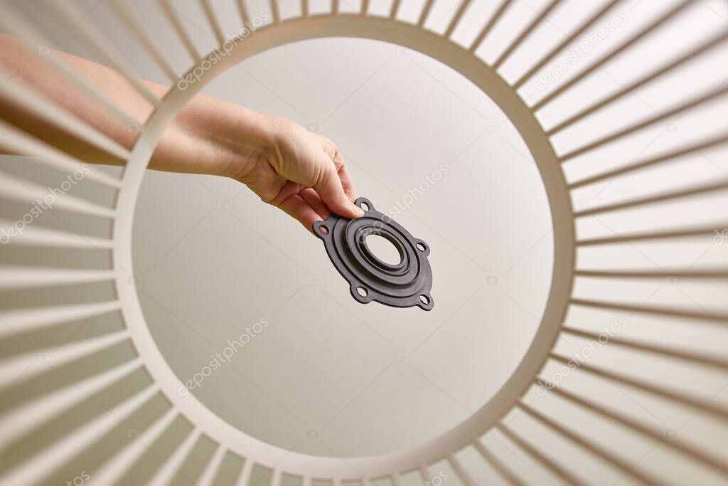 The rubber gasket is thrown into the trash for disposal and recycling