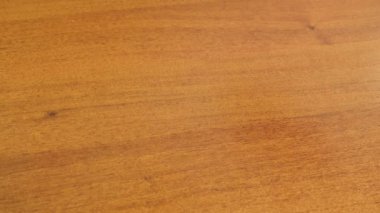 Plastic elements of the children's constructor fly to the sides, falling on the table.