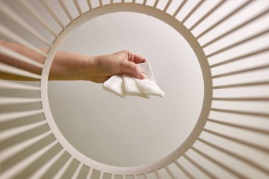 Paper napkins are disposed of and recycled in the trash can. View from below. The concept of disposal and recycling of waste.