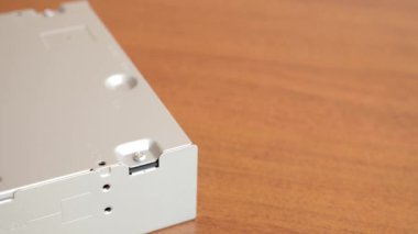 During the repair of an electronic gadget, a screw is unscrewed with a screwdriver.