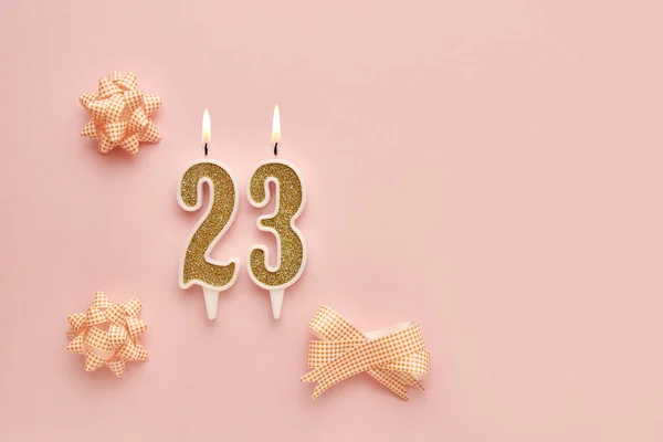 stock image Number 23 on a pastel pink background with festive decorations. Happy birthday candles. The concept of celebrating a birthday, anniversary, important date, holiday. Copy space. banner